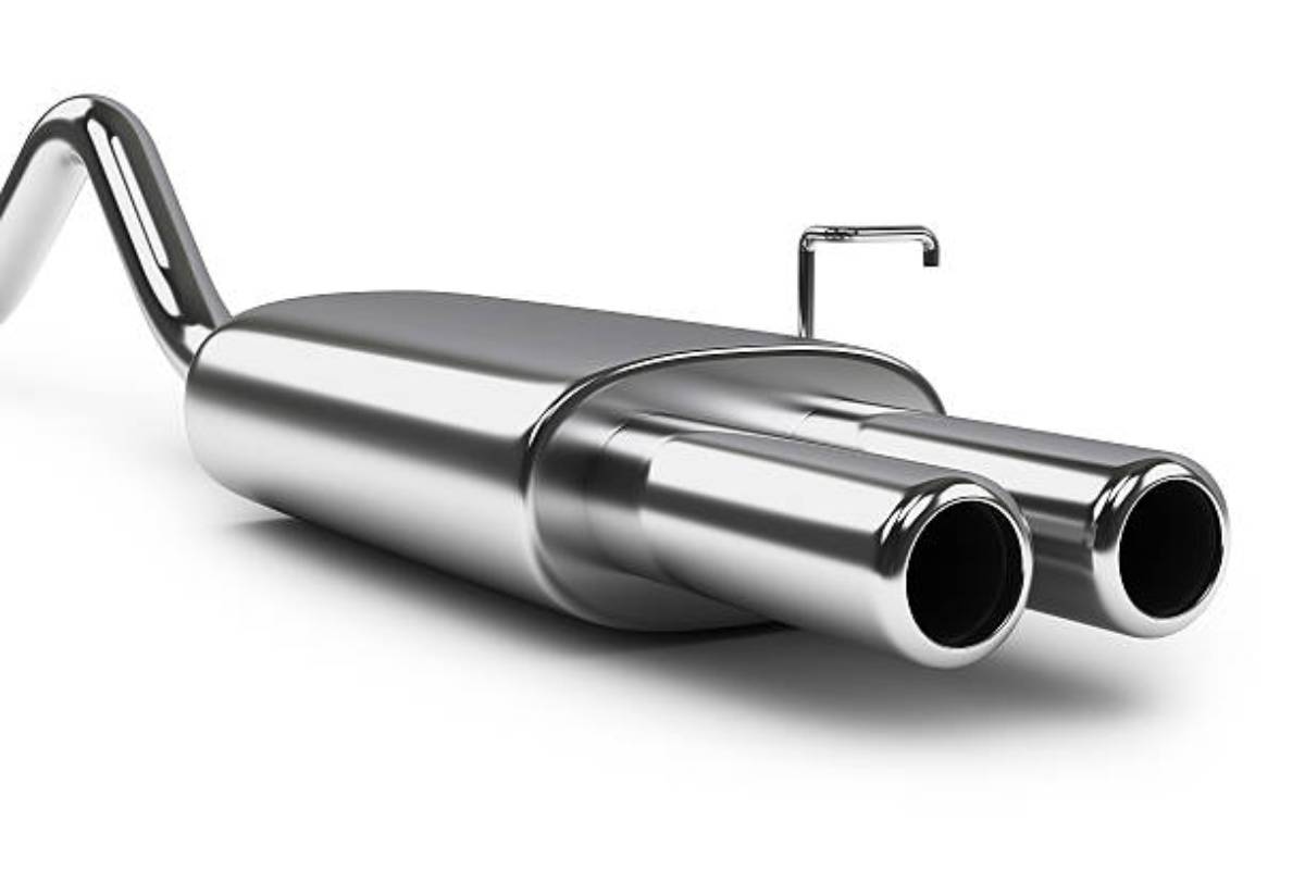 A shiny, chrome dual exhaust muffler with two symmetrical outlets, designed for enhancing vehicle performance and sound.